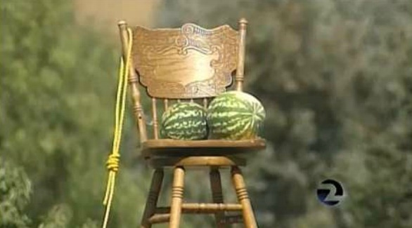 Photo Empty Chair, Watermelon, and Noose