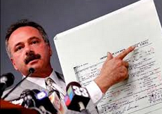 Photo of Mike Zullo holding enlarged Obama Long Form birth certificate