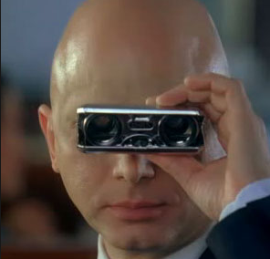 Observer character (bald man in black suit using opera glass) from the Fringe TV series