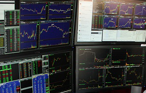 4 computer monitors with day trading software